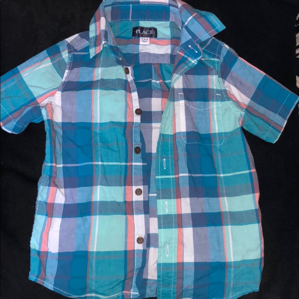 B5: Children place bottom up shirt